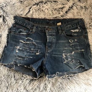 Distressed blue jean shorts